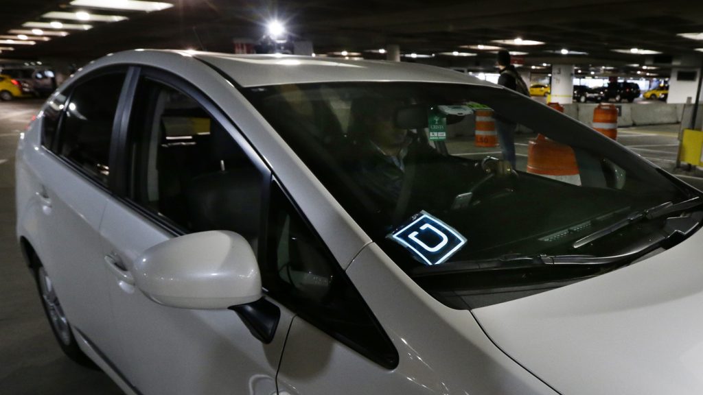 A driver for Uber arrives at an authorized customer pickup area at Seattle-Tacoma International Airport.