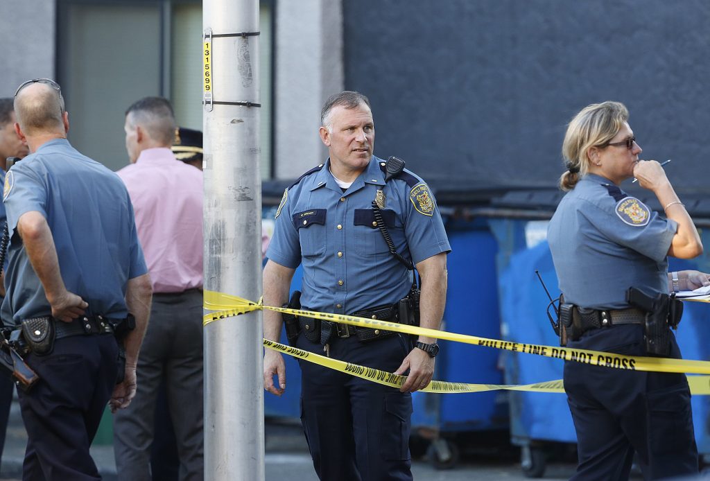 Seattle, Wa. September 4, 2014. Seattle police officers investigate a scene at 41st and Roosevelt Way Thursday evening.