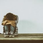 Sad woman hug her knee,nobody