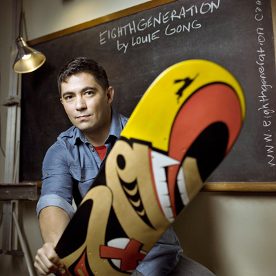 Nooksack, Chinese, French and Scottish artist, educator and 'Mockups' designer Louie Gong with a skateboard adorned with an example of his signature original designs that fuse Coast Salish imagery with elements from popular culture and his mixed heritage. Photo: Kiliii YuMosaic Coffeehouse