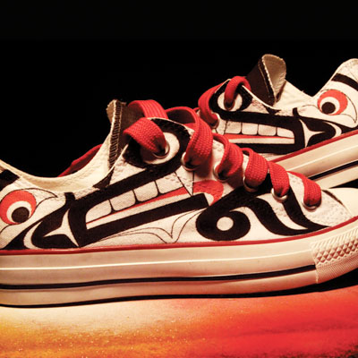 Louie Gong, a Nooksack, Chinese, French and Scottish artist, educator, and activist who now lives in Seattle creates custom shoes that incorporate Coast Salish imagery with elements from popular culture and his mixed heritage. Photo: Eighth Generation, LLC